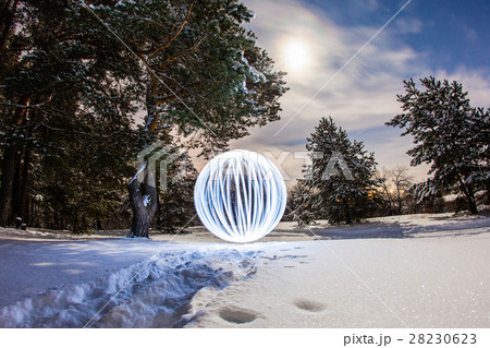 Luminous sphere in a night winter forest Luminous sphere in a night winter forest 28230623