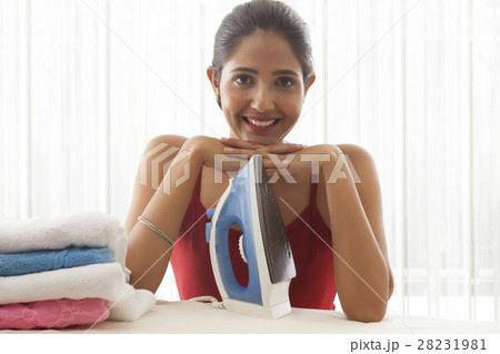 young woman ironing young woman ironing 28231981