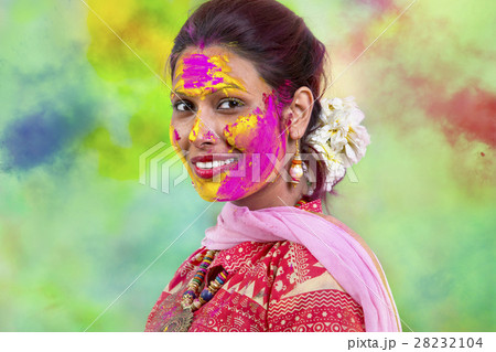 Portrait of  young Indian Woman celebrating Holi color festival 28232104