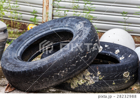 Old tire indicating breeding ground for mosquito Old tire indicating breeding ground for mosquito 28232988