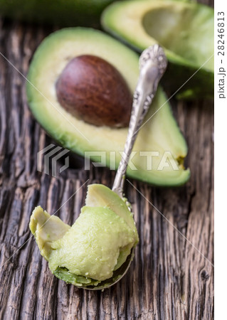 Avocado.Cut avocado on a oak wood background table 28246813