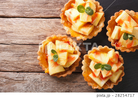 Mini Tart with pineapple and mint close-up Mini Tart with pineapple and mint close-up 28254717