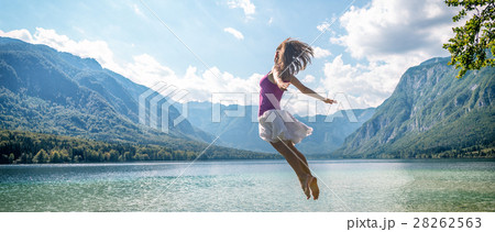 Girl jumping on the lake 28262563