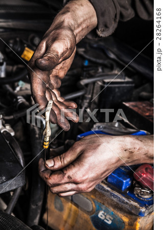 Dirty man hands and car engine Dirty man hands and car engine 28264168
