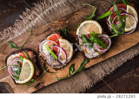 Bread, salmon, herring, onion and lemon diagonal Bread, salmon, herring, onion and lemon diagonal 28271265