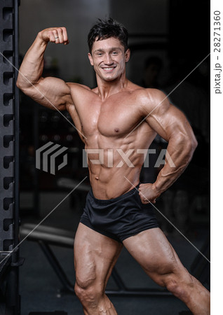 Handsome bodybuilder training in the gym sexy m Handsome bodybuilder training in the gym sexy m 28271360