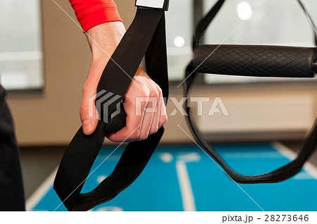 Male hands with fitness straps in gym. Male hands with fitness straps in gym. 28273646