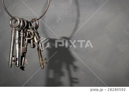 Old vintage key on rustic background Old vintage key on rustic background 28280592
