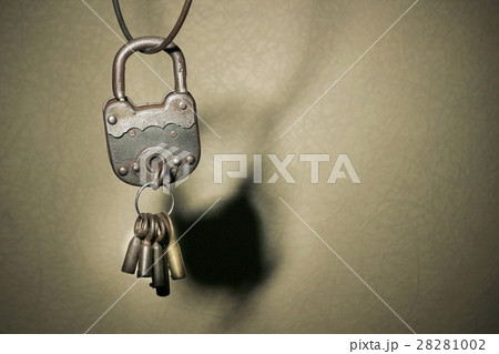 Old vintage padlock on rustic background 28281002