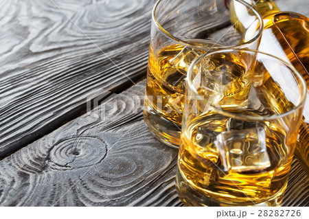 Detail of glasses and a bottle of whiskey 28282726