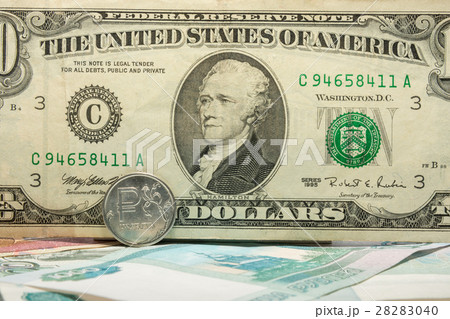 The inscription on the ten ten-dollar bill covered ruble coin The inscription on the ten ten-dollar bill covered ruble coin 28283040