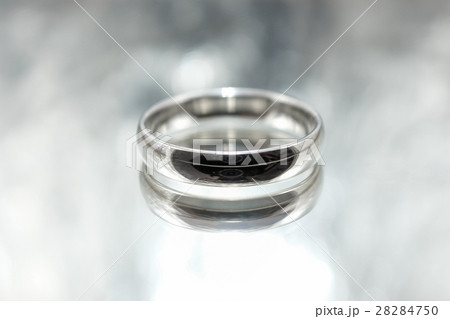 Men's silver ring on a gray background Men's silver ring on a gray background 28284750