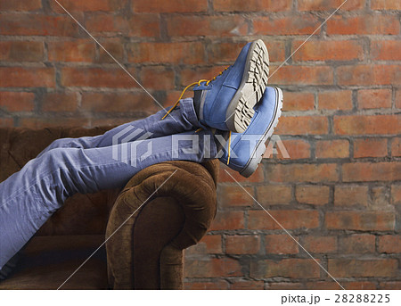 Half body of a female, posing her jeans and boots 28288225