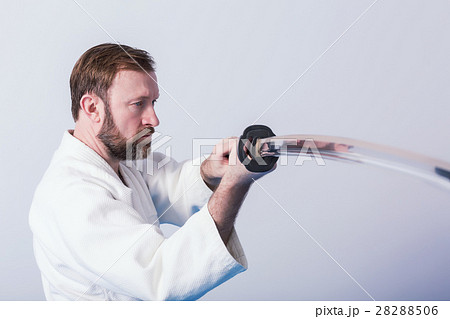 A man with katana on Iaido practice 28288506
