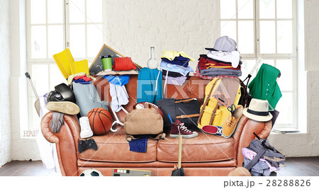 Large leather sofa with a bunch of different thing 28288826