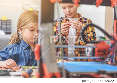Concentrated children playing in workshop 28290622