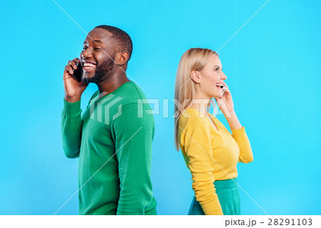 Happy man and woman communicating on smartphones 28291103