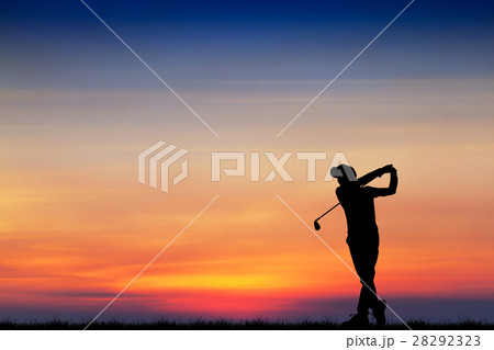 silhouette golfer playing golf during at sunset 28292323