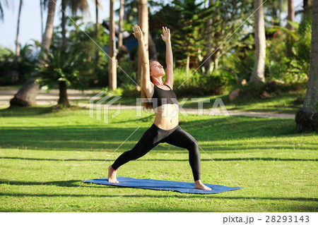 Attractive woman practices yoga in nature.. Attractive woman practices yoga in nature.. 28293143