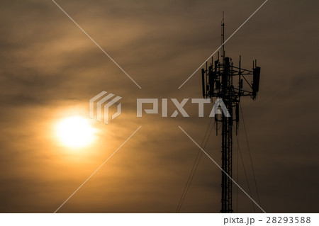 silhouette of cellphone mast against sunset 28293588