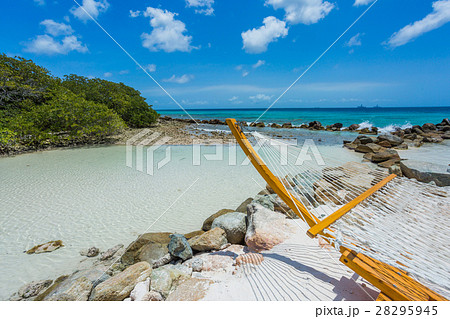 Empty hammock on tropical beach Empty hammock on tropical beach 28295945