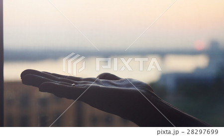 Female hand on blurred city background 28297699