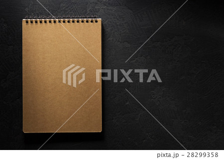 notebook on black background notebook on black background 28299358