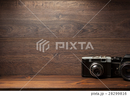 old camera at shelf wall wood 28299816