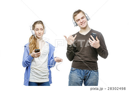 Teen boy and girl with headphones 28302498