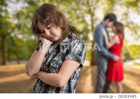 Jealousy girl seeing her boyfriend flirting 28303485