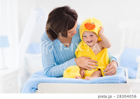 Mother and baby in towel after bath 28304056