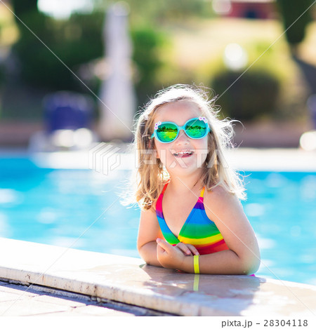Child in swimming pool on summer vacation Child in swimming pool on summer vacation 28304118