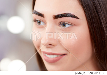 Girl during procedure of permanent make up of Girl during procedure of permanent make up of 28304197
