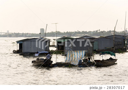 Fish farm houses floating on Mekong river, Vietnam Fish farm houses floating on Mekong river, Vietnam 28307017