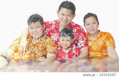 Family playing water during Songkran festival Family playing water during Songkran festival 28310207