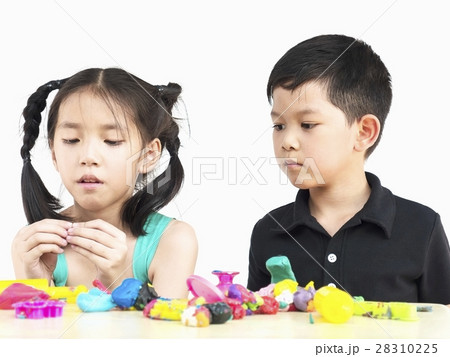 Asian kids playing colorful clay toy Asian kids playing colorful clay toy 28310225