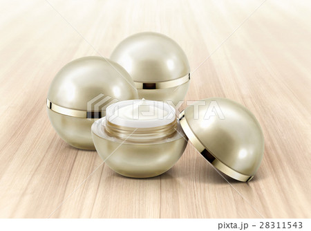 Golden sphere cosmetic jar on wood background Golden sphere cosmetic jar on wood background 28311543