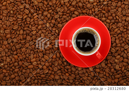 Americano in red cup with saucer on coffee beans Americano in red cup with saucer on coffee beans 28312680