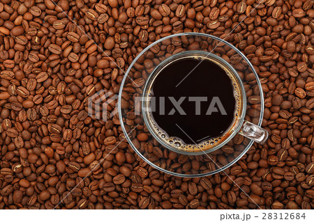 Black coffee transparent full glass cup on beans 28312684