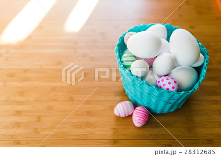 Easter basket with eggs on a wooden floor 28312685