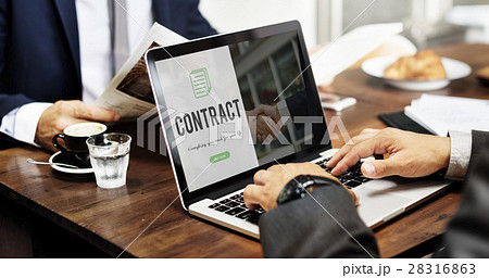 Contract word on business handshake background Contract word on business handshake background 28316863