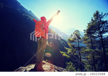 hiker open arms to sunrise on himalaya mountains hiker open arms to sunrise on himalaya mountains 28322088