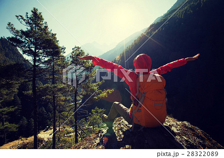 hiker open arms to sunrise on himalaya mountains hiker open arms to sunrise on himalaya mountains 28322089