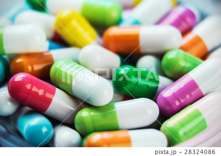 different color background pills and tablets 28324086