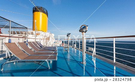 upper deck of cruise liner with empty chairs 28324798