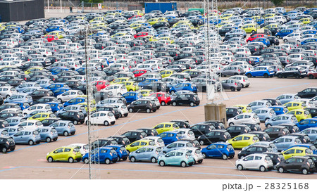 many cars in parking lot in copenhagen harbor 28325168
