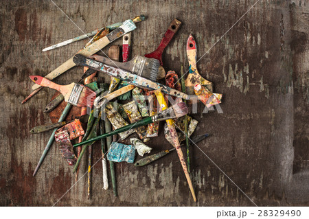 paint brushes and tubes of oil paints on wooden 28329490