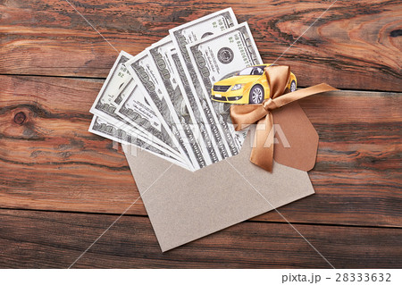 Envelope with dollars and bow. Envelope with dollars and bow. 28333632