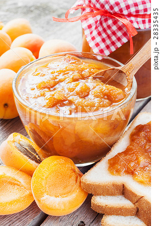 apricot fruits and jar of jam on table 28335435