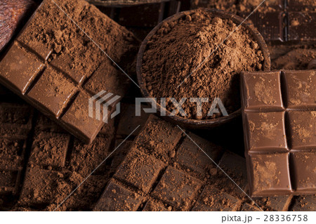 Dark and milk chocolate bar on a wooden table Dark and milk chocolate bar on a wooden table 28336758